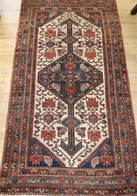 A Caucasian ivory ground rug 190 x 107cm approx.